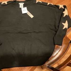 Sweet Romeo black long sleeve sweater with tan stars on sleeves . Size L.